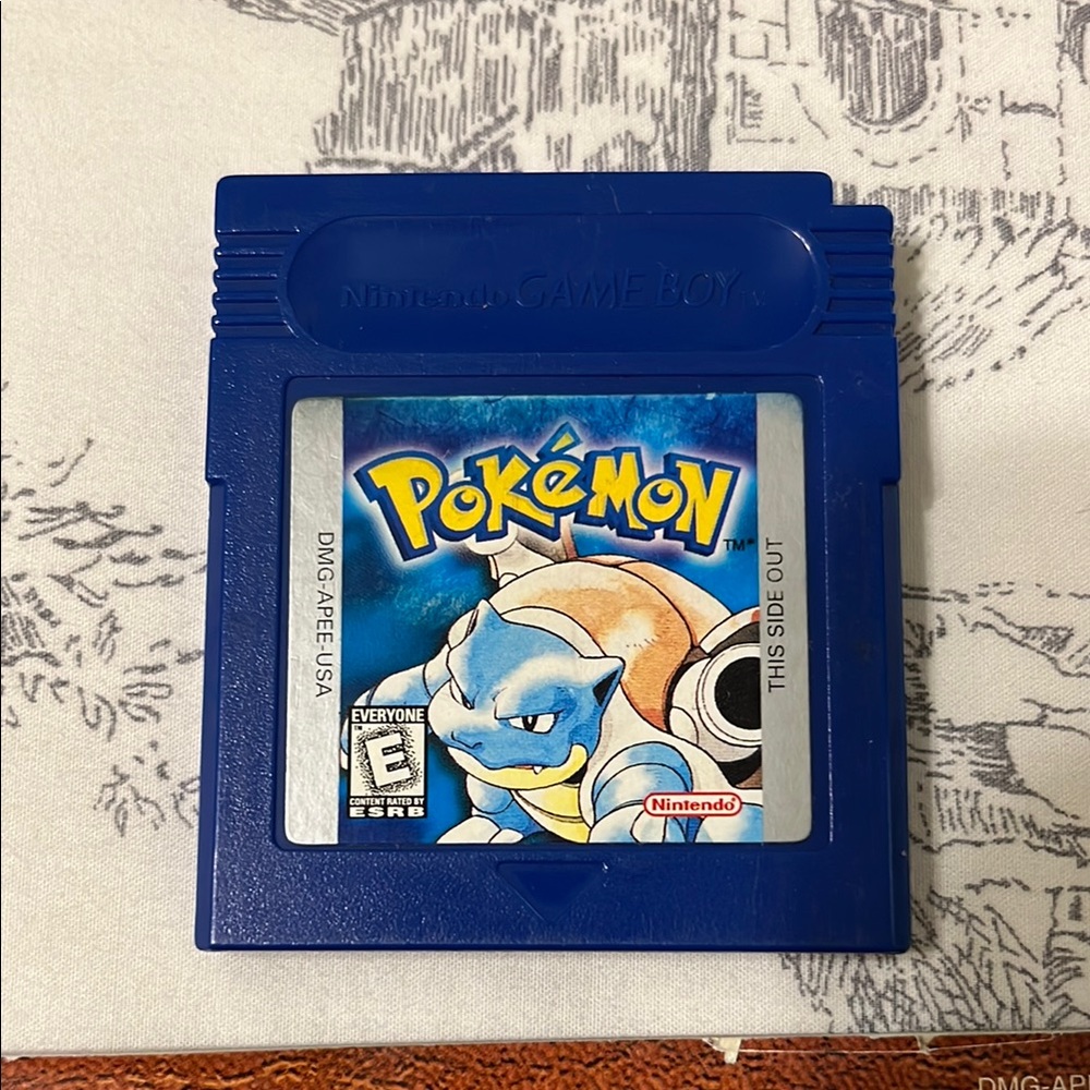Pokemon Blue Game Cartridge and Brown Trainer's Guide